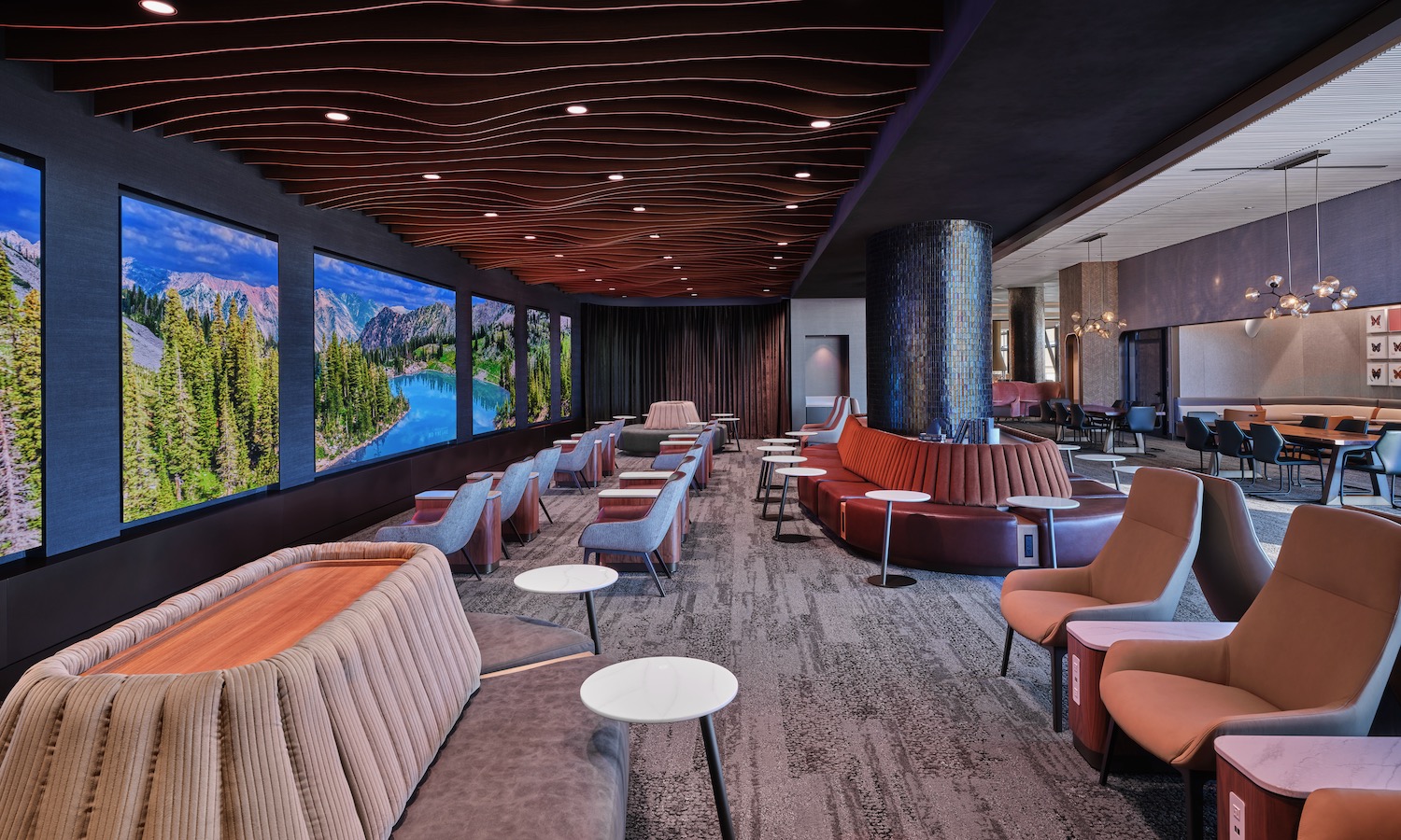 a room with a large television screen and couches