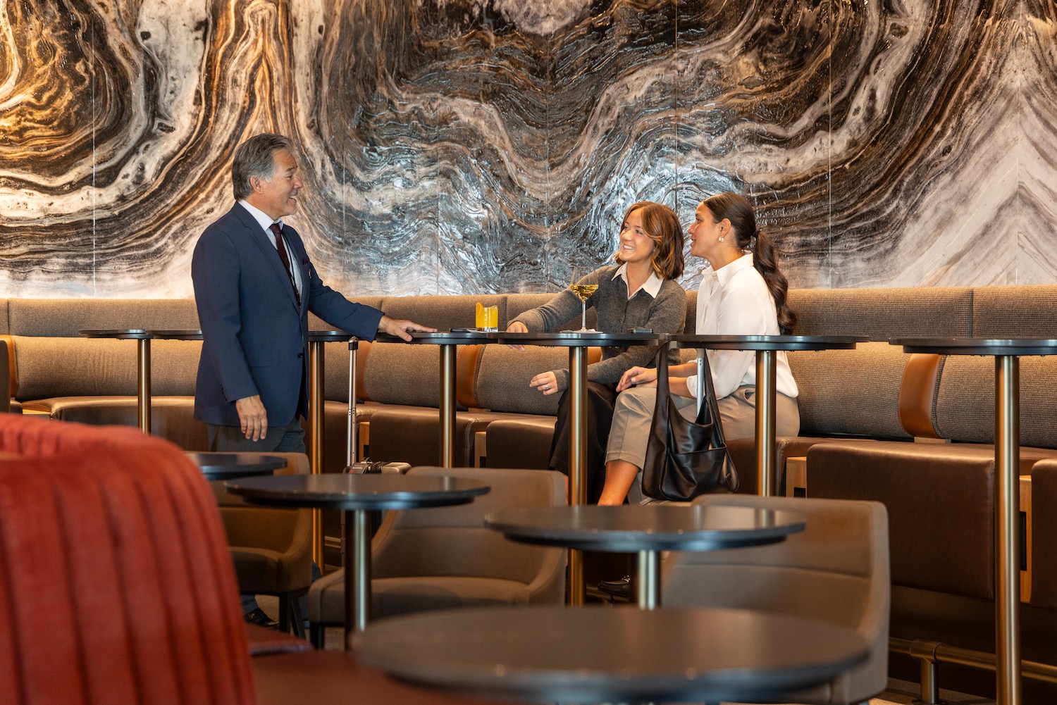 a group of people sitting at tables