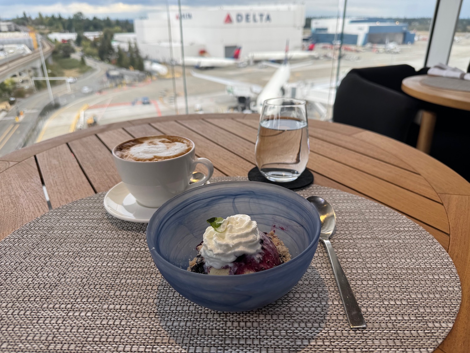 a cup of coffee and a dessert on a table