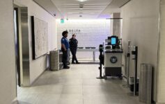 a group of people standing in a hallway