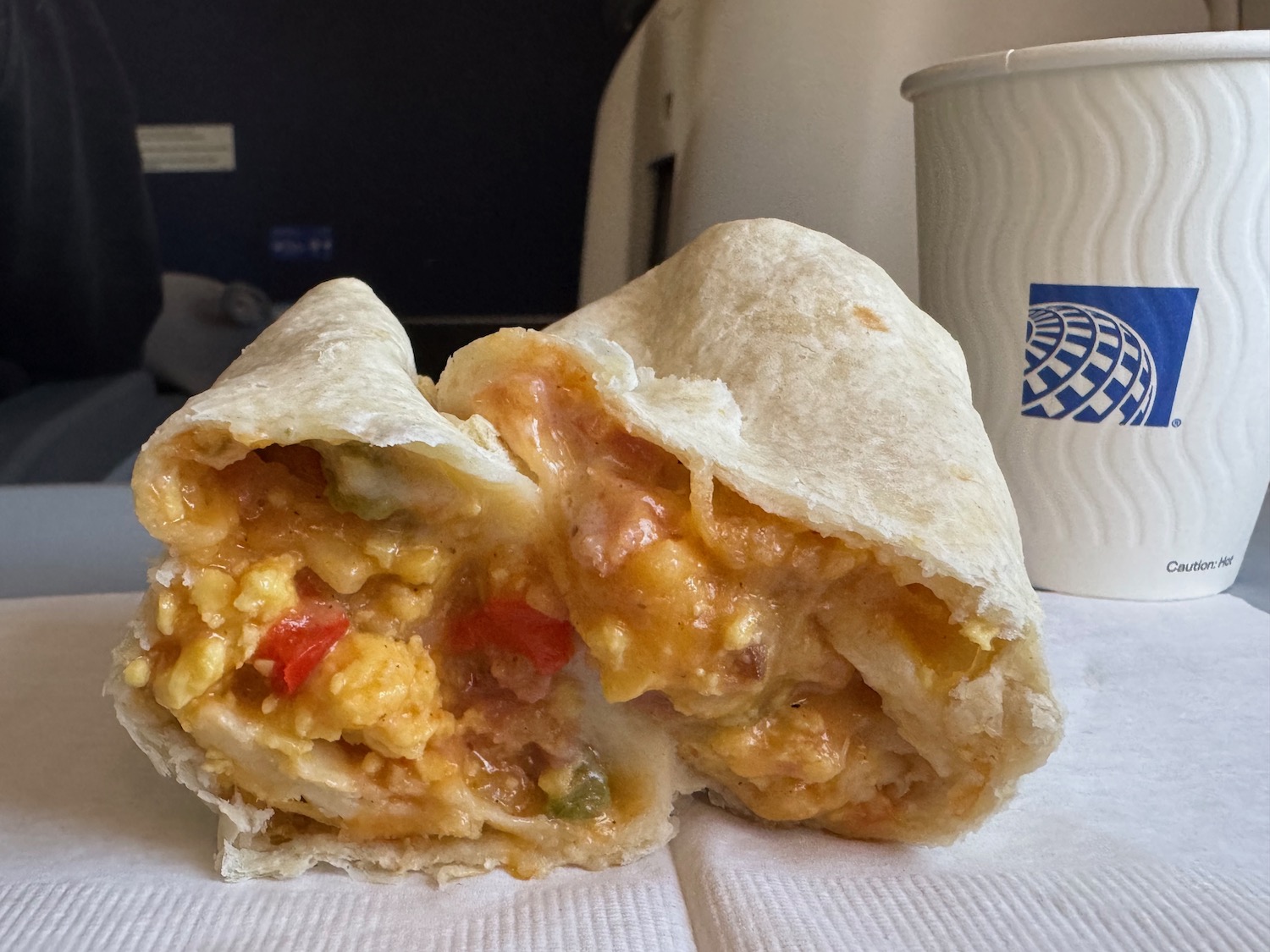 a burrito with a bite taken out of it