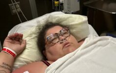 a woman lying in a hospital bed