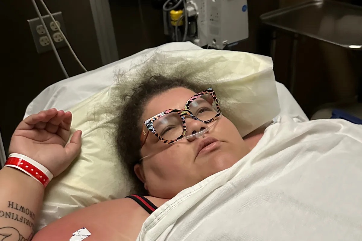 a woman lying in a hospital bed