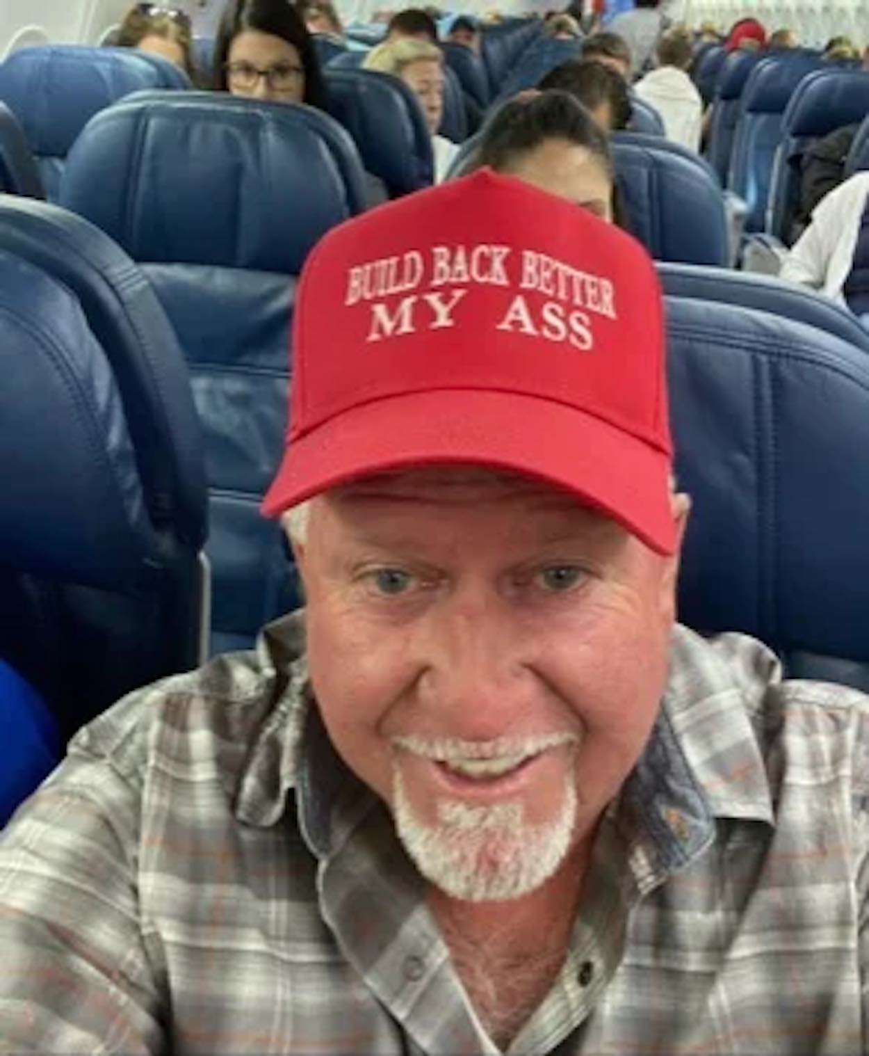 a man wearing a red hat