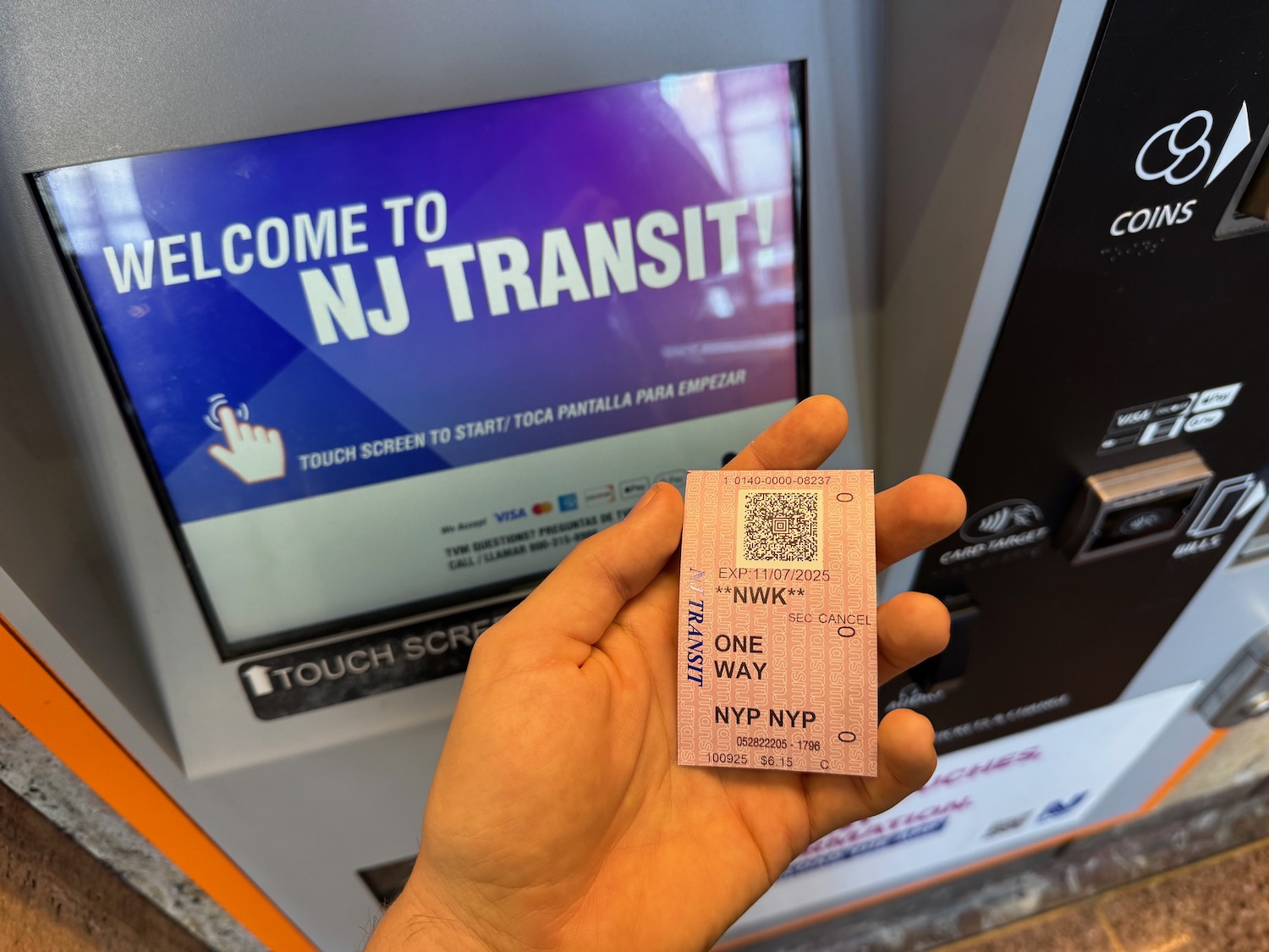 a hand holding a ticket