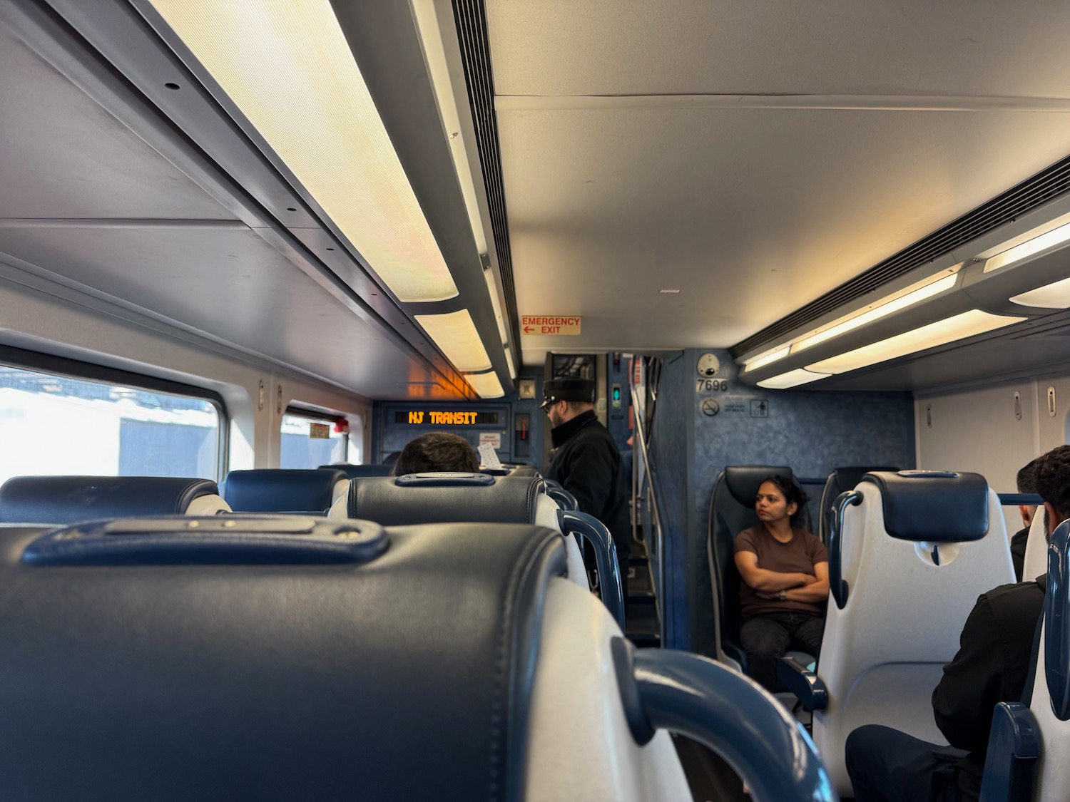a woman sitting in a train