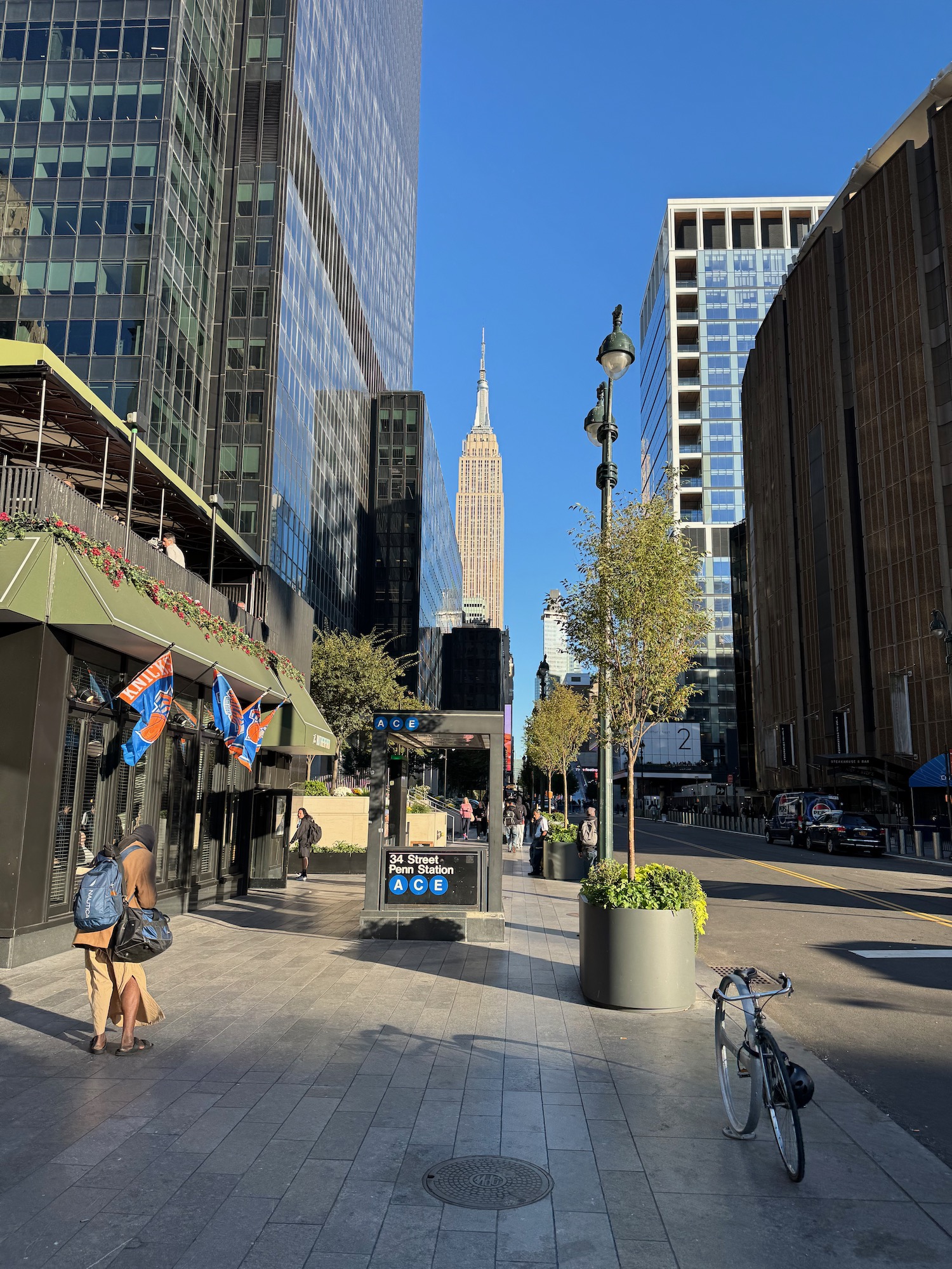 a city street with tall buildings and people walking