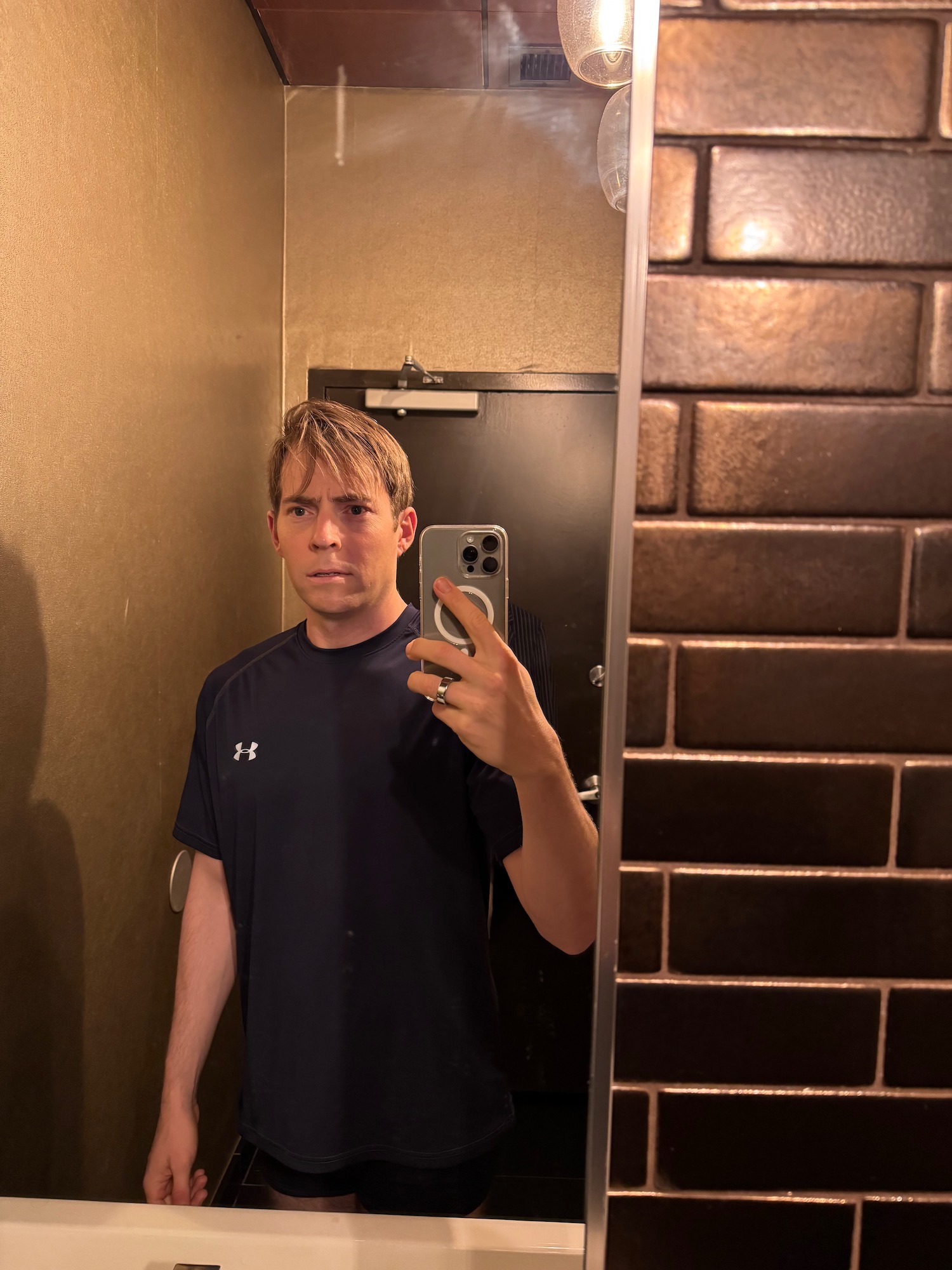 a man taking a selfie in a mirror