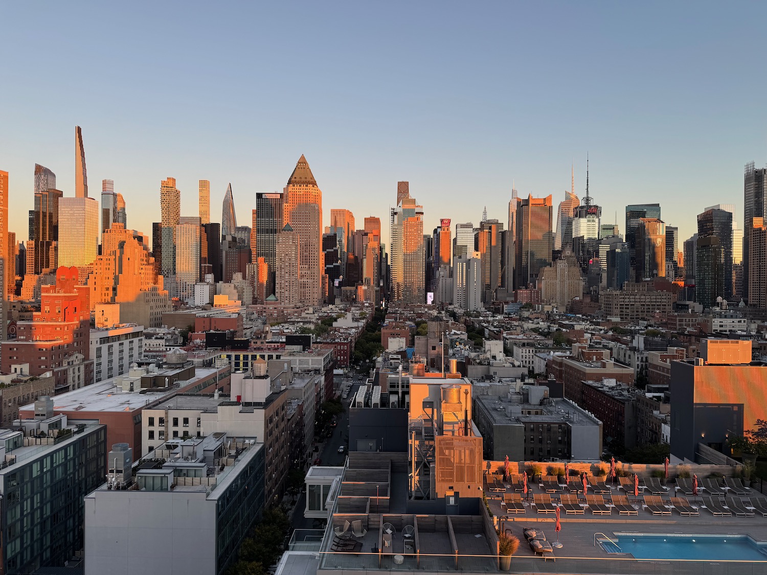 a city skyline with a pool