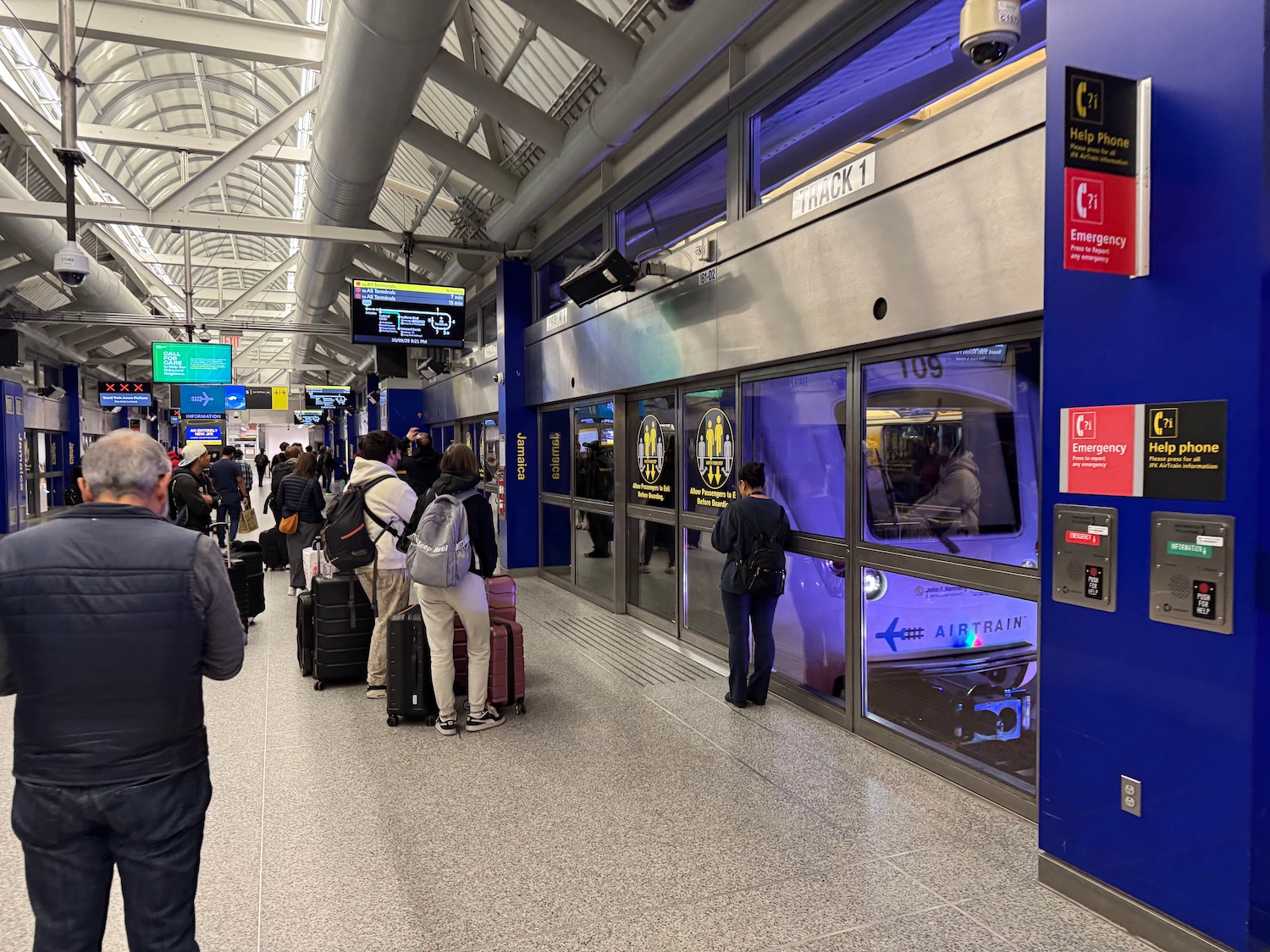 a group of people standing in a terminal