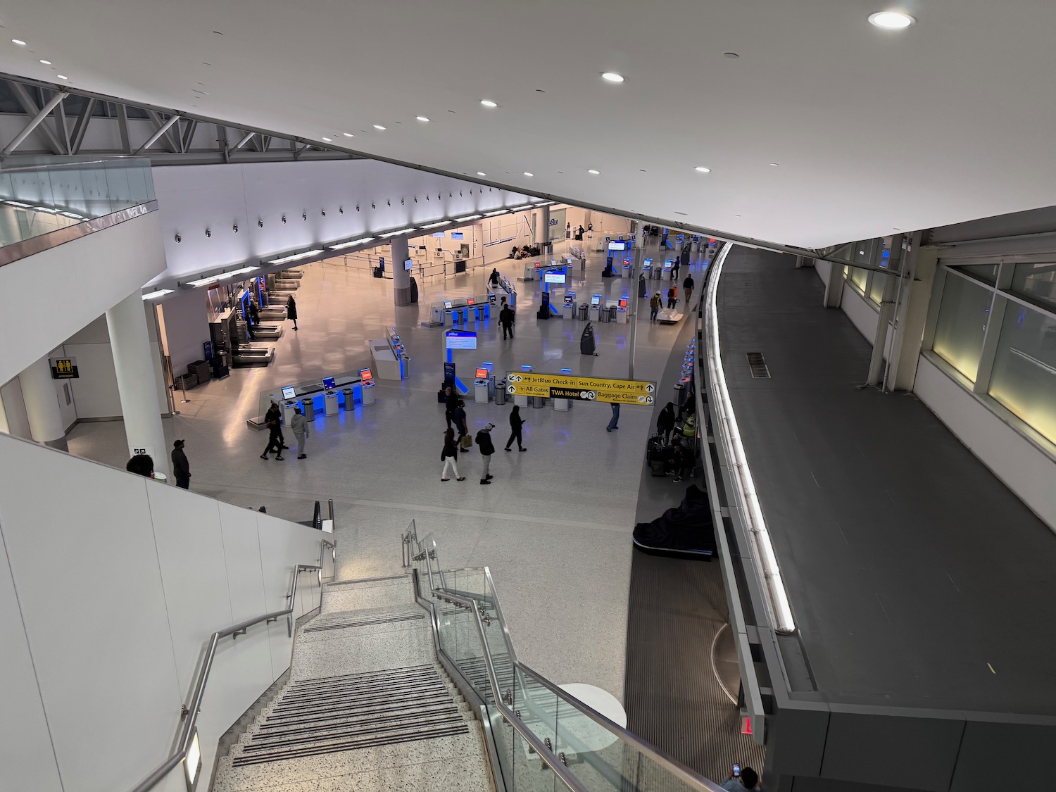 a group of people walking in a large airport