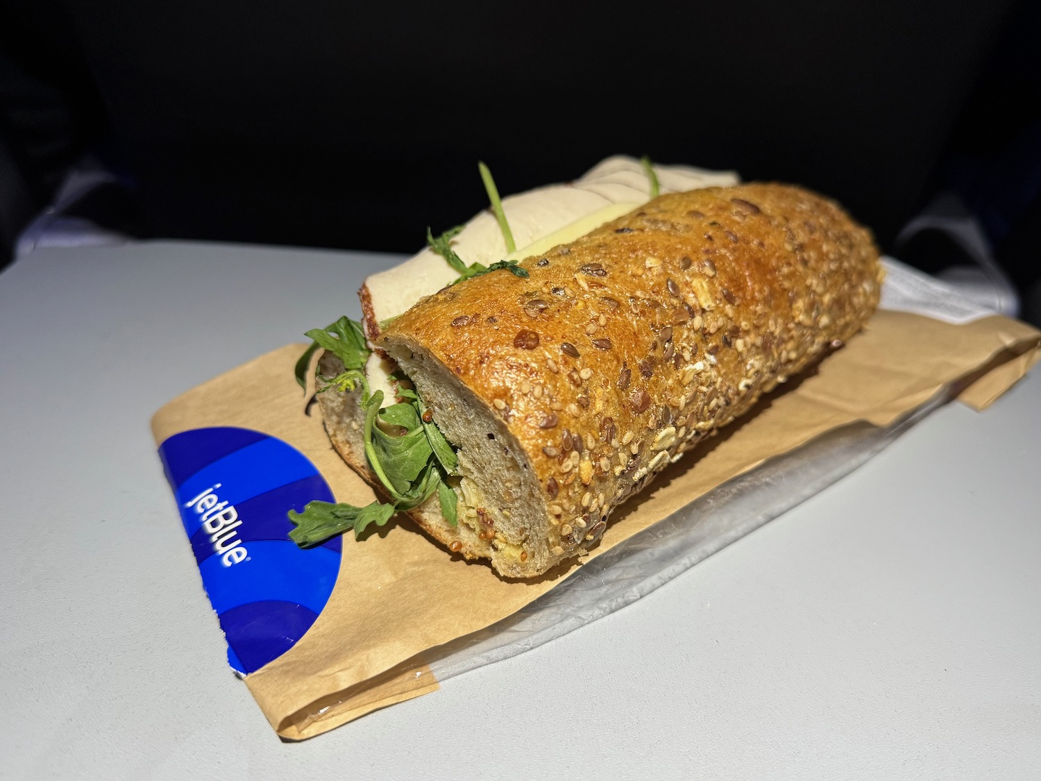 a sandwich on a paper bag
