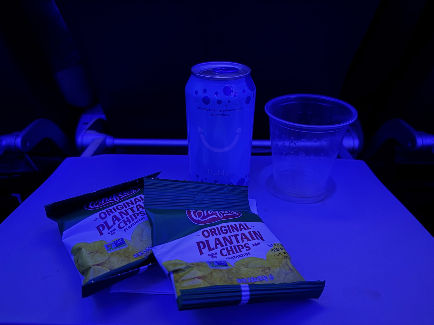 a drink and chips on a table