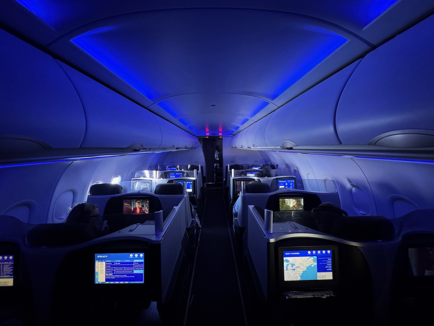 inside an airplane with blue lights