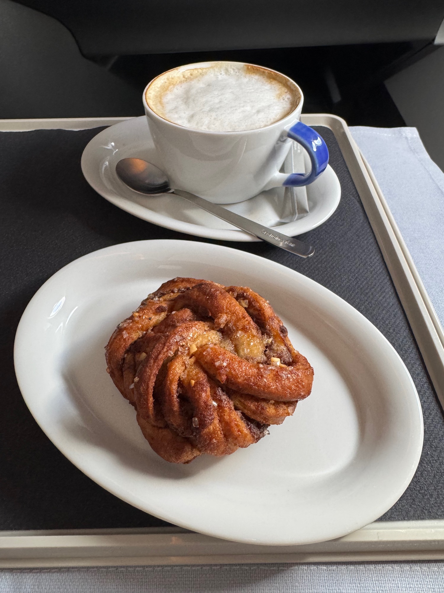 a plate of food and a cup of coffee