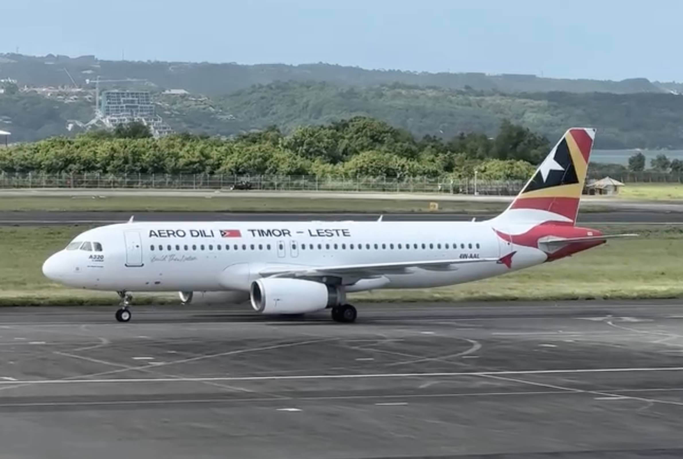 a white airplane on a runway