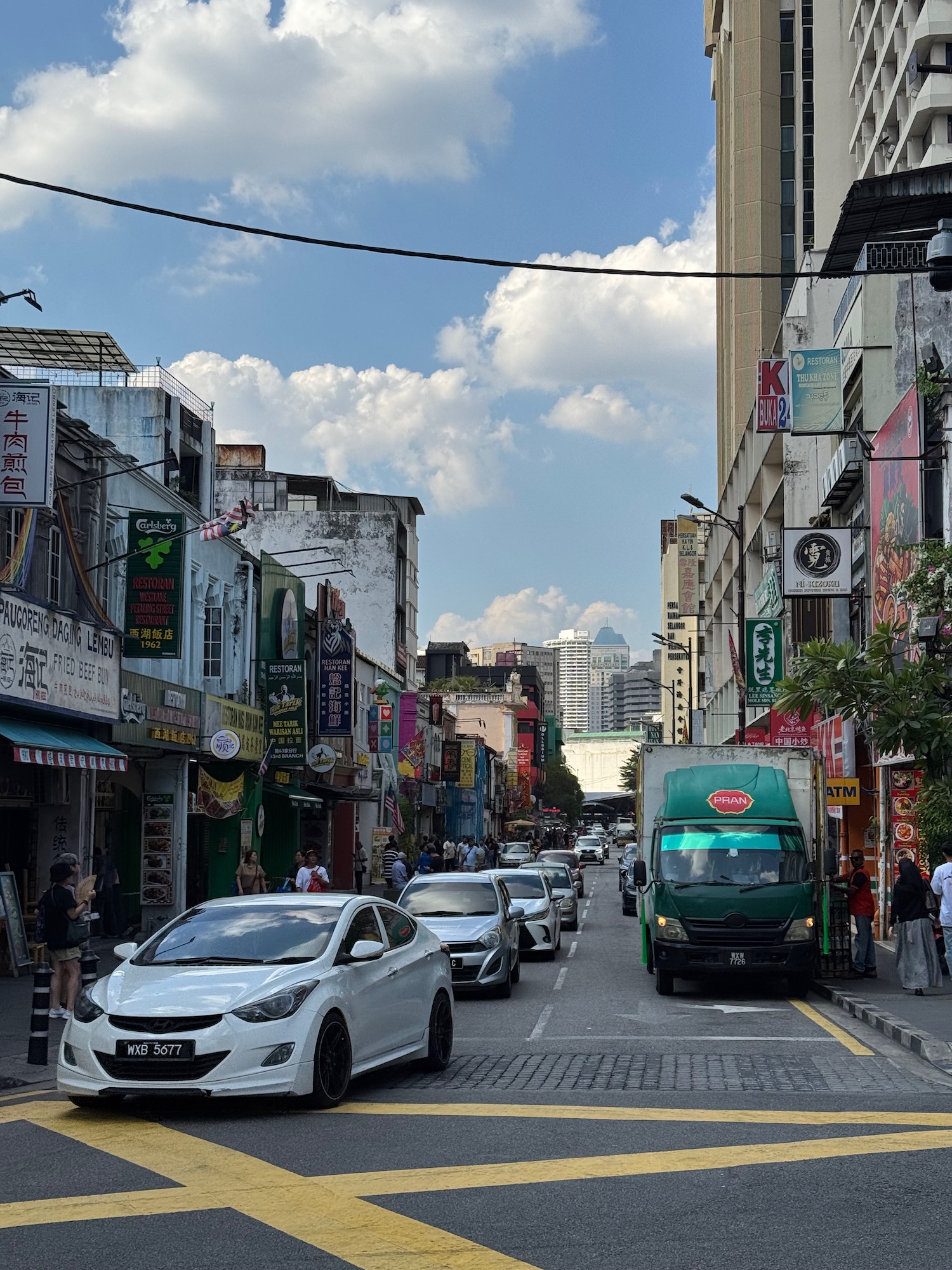 a street with cars and buildings