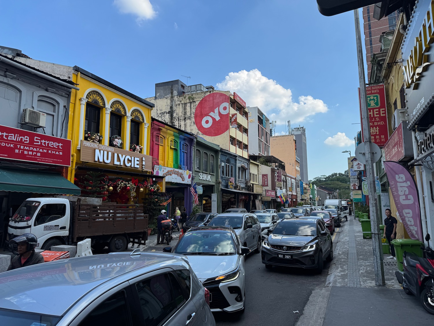 a street with cars and buildings