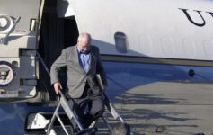 a man walking down a plane