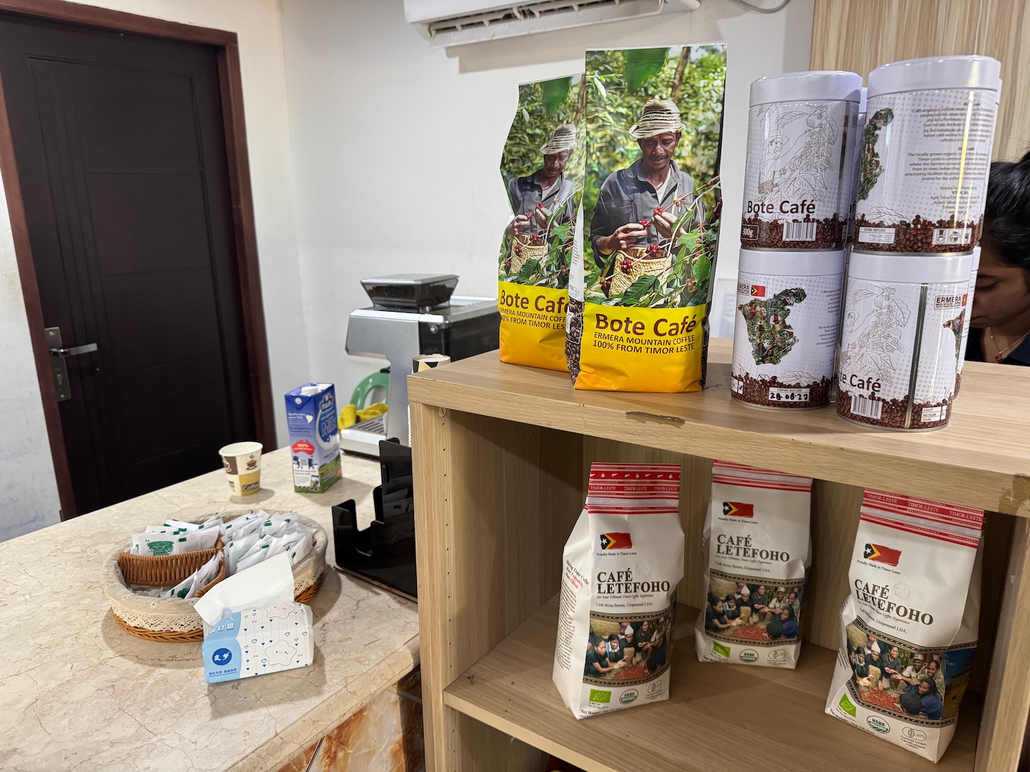 a shelf with bags of coffee on it