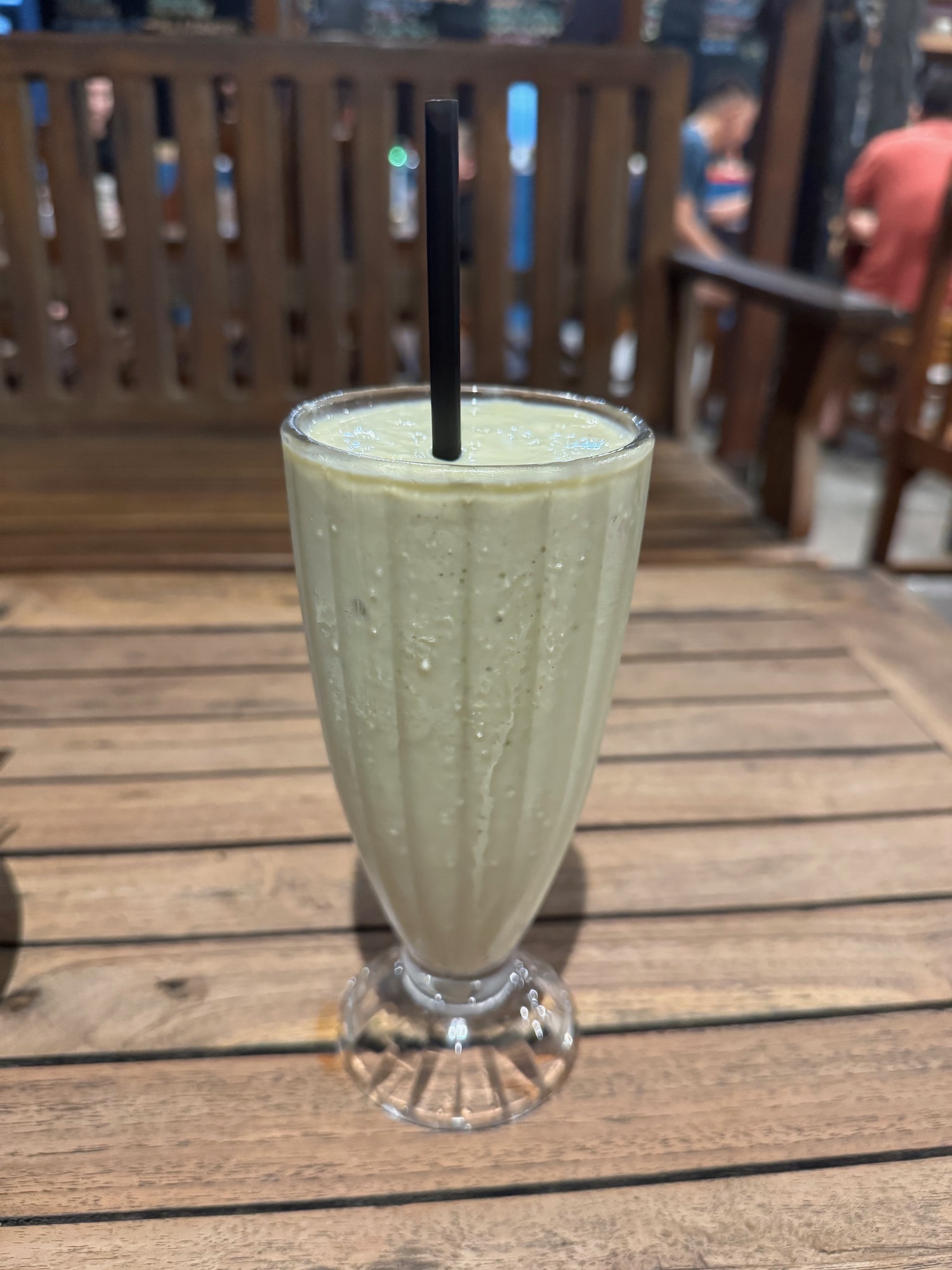 a glass with a straw in it