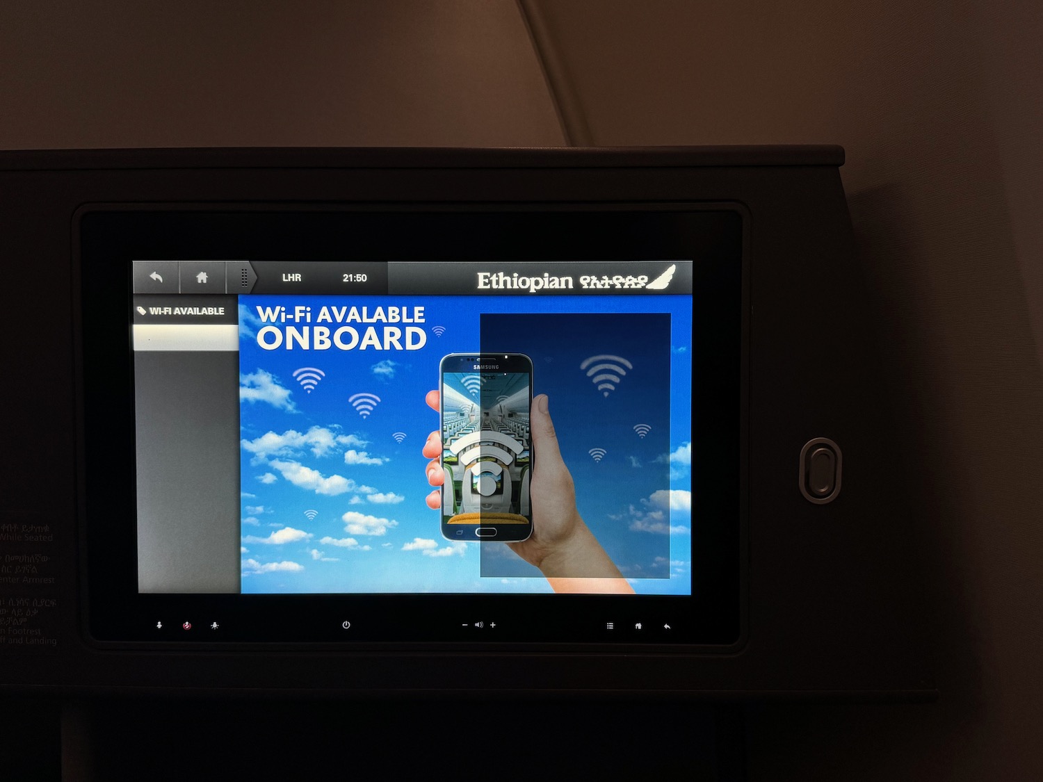 a screen with a picture of a hand holding a phone