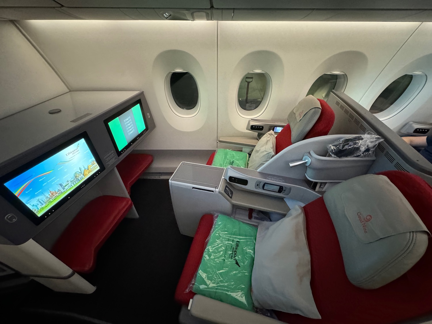 a seat and a monitor in a plane