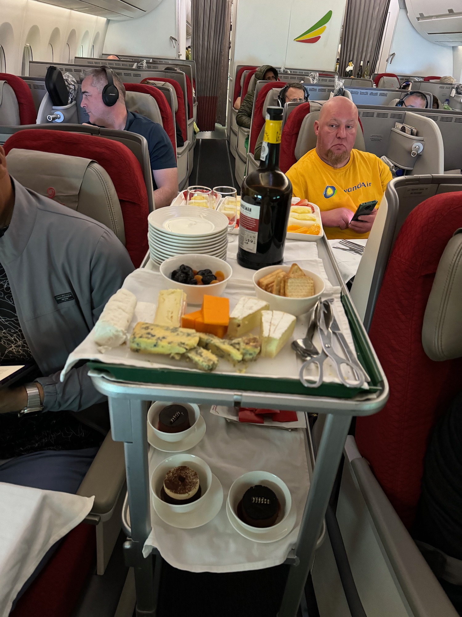 a group of people sitting in an airplane