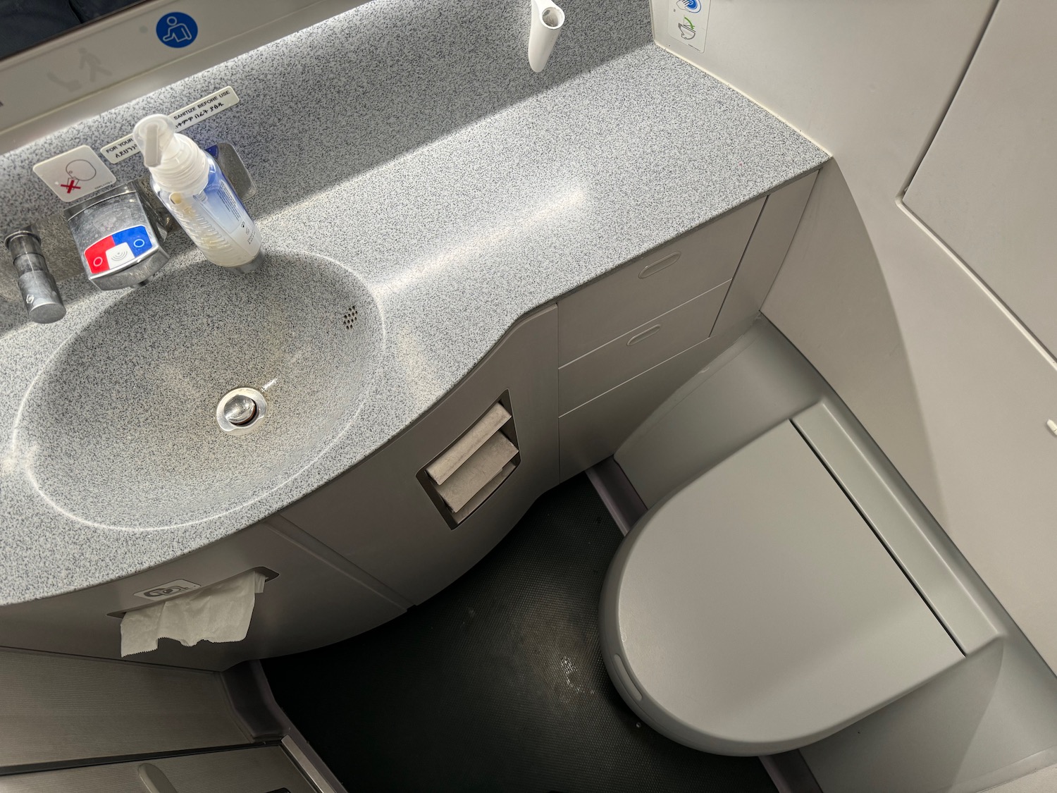 a sink and toilet in an airplane