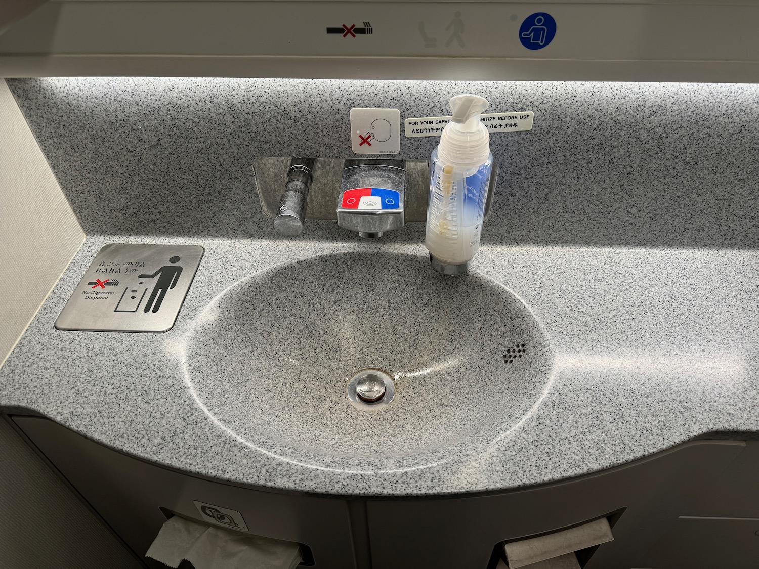 a sink with a soap dispenser