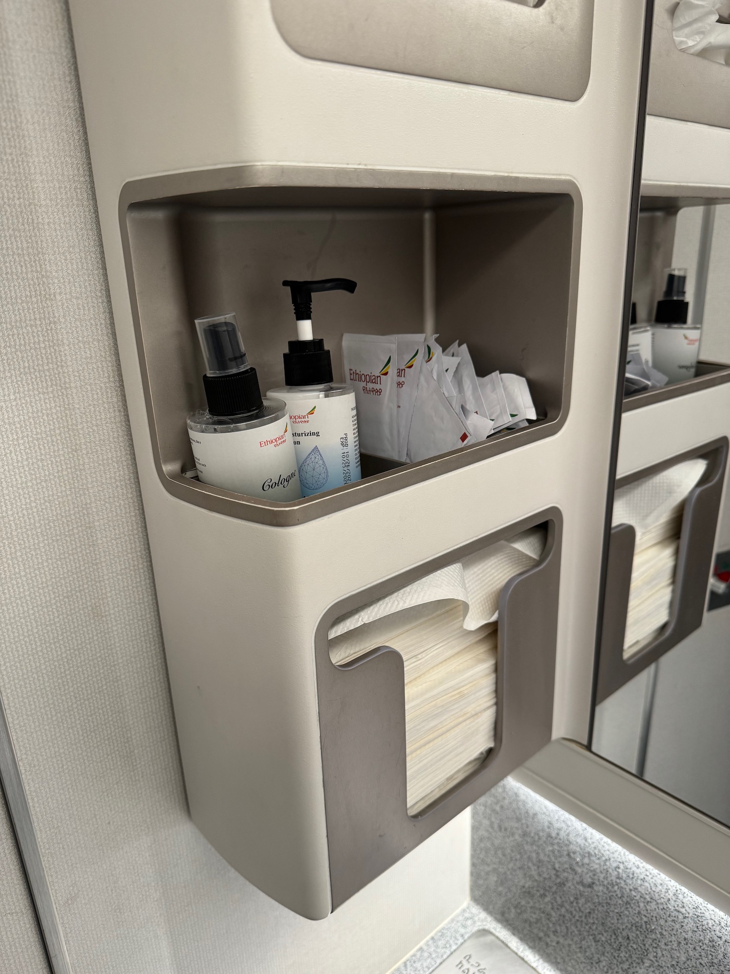 a shelf with a lotion and tissue paper