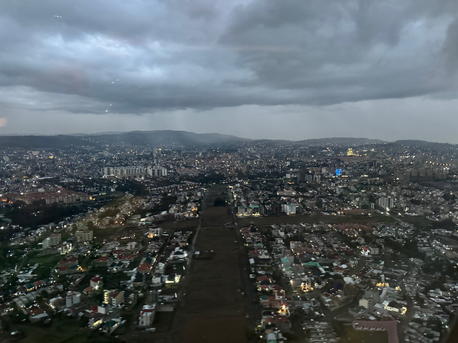 a cityscape with many buildings and a path