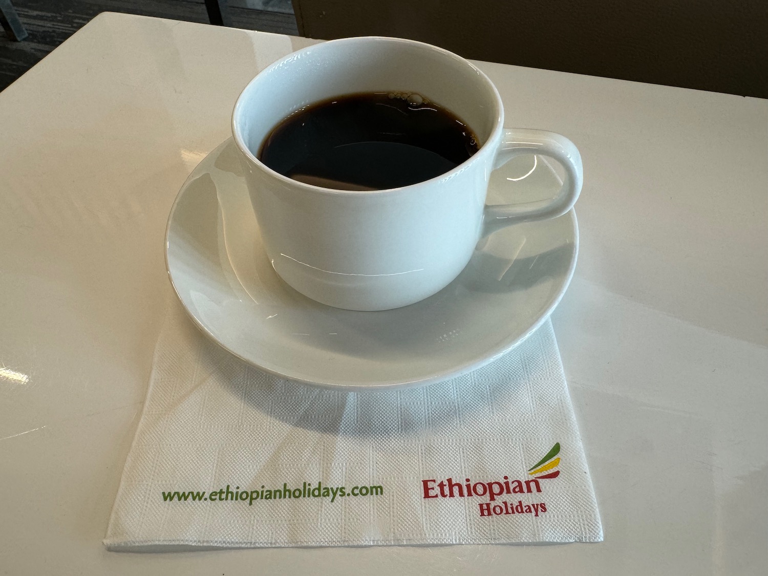 a cup of coffee on a napkin