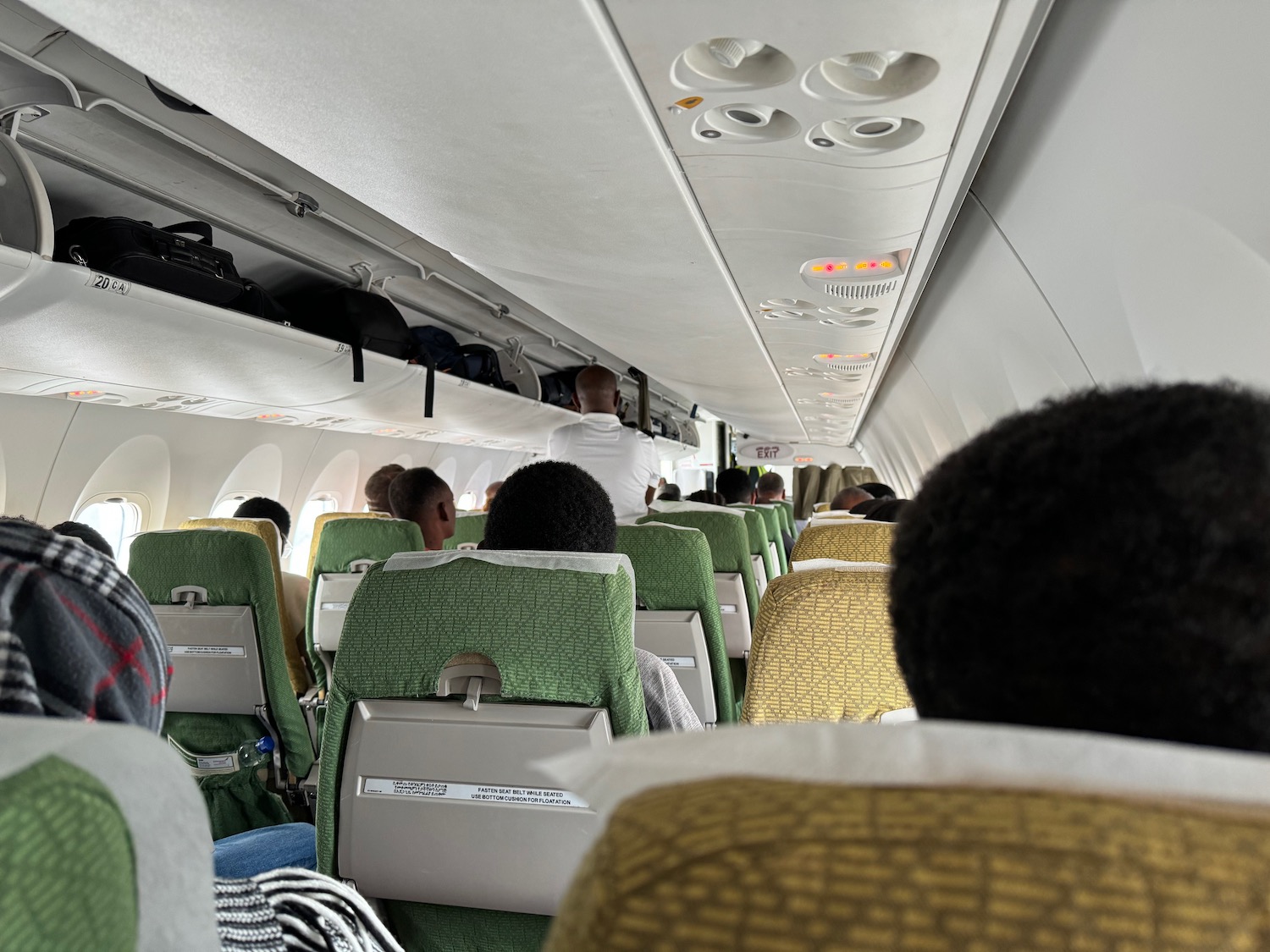 a group of people sitting on an airplane