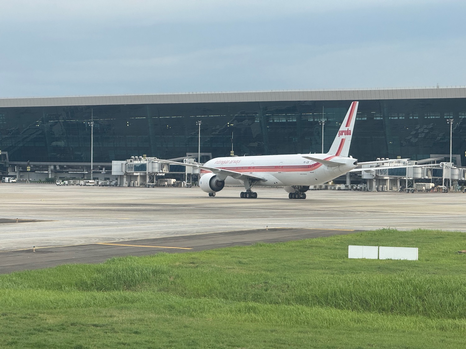 a white airplane on a runway