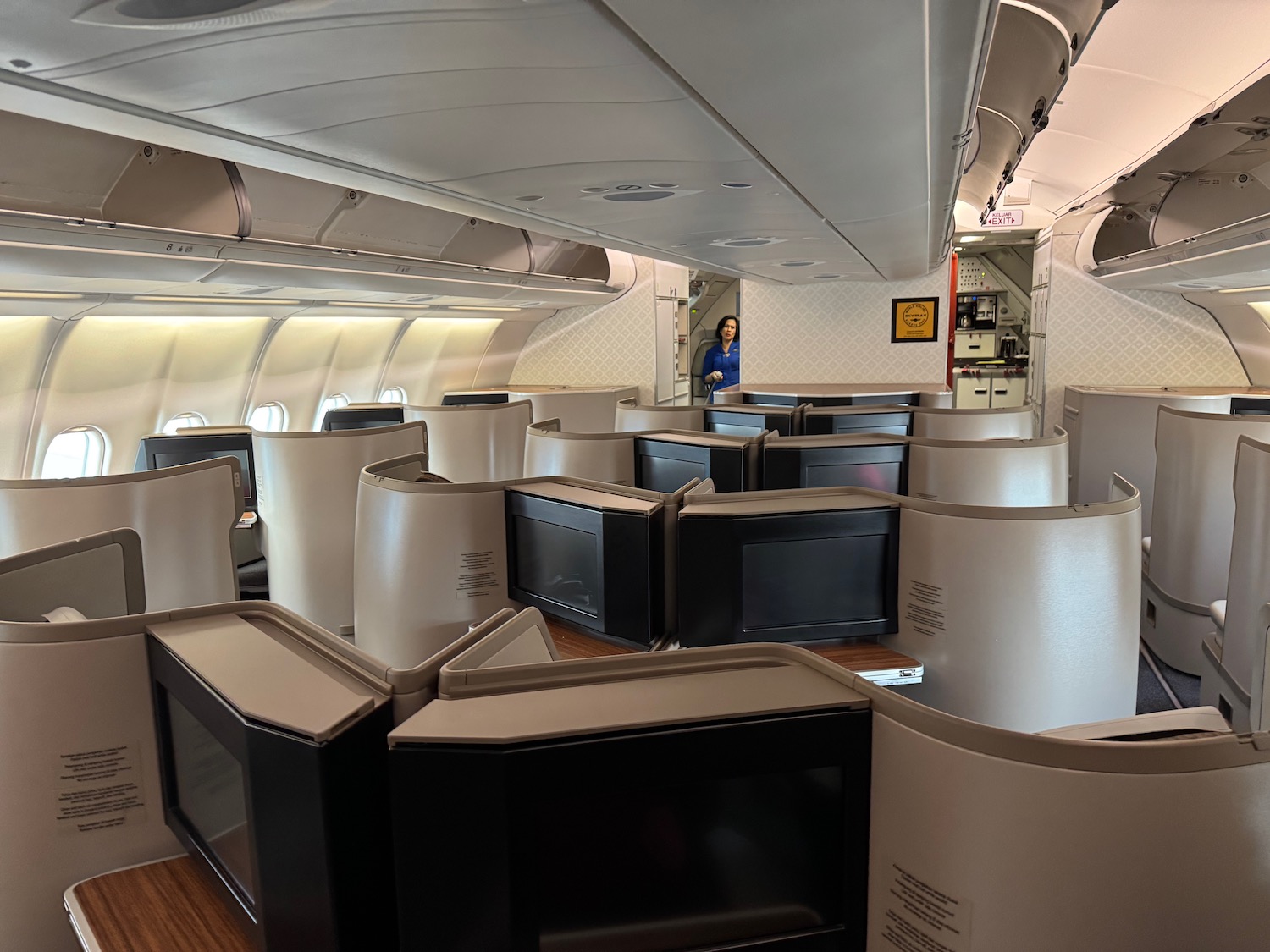 a woman standing in a room with computers