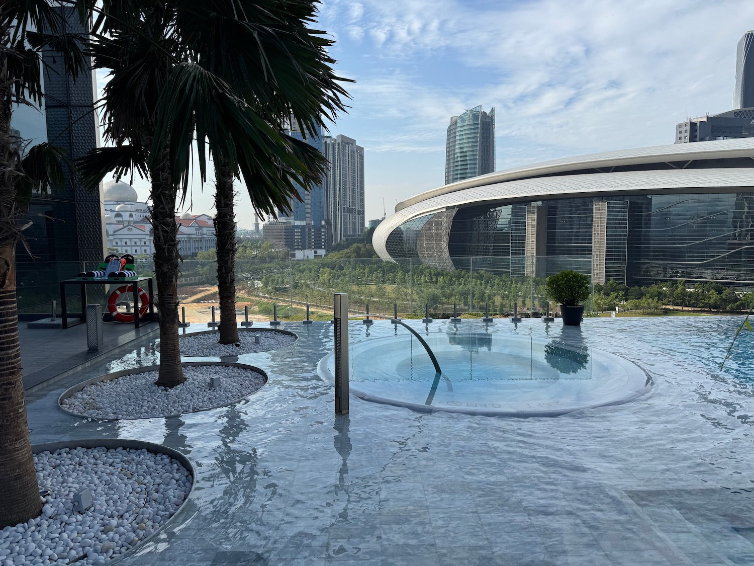 a pool with a large building in the background