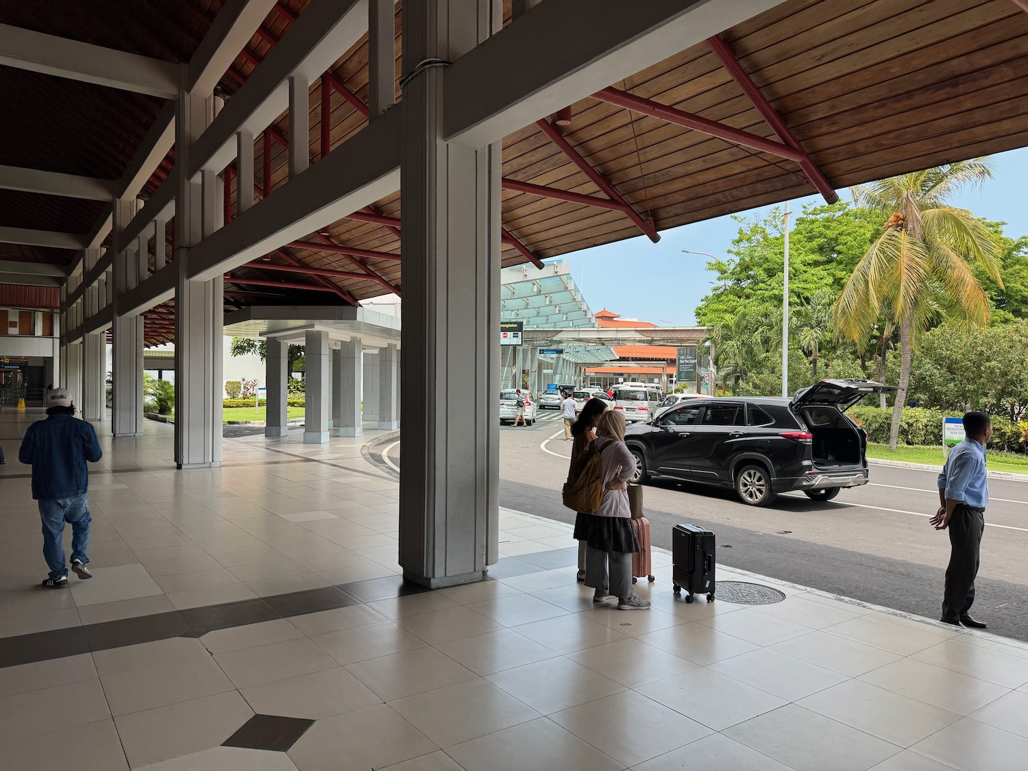 two people standing outside a building