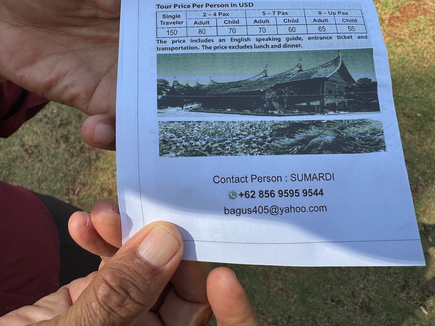 a hand holding a piece of paper