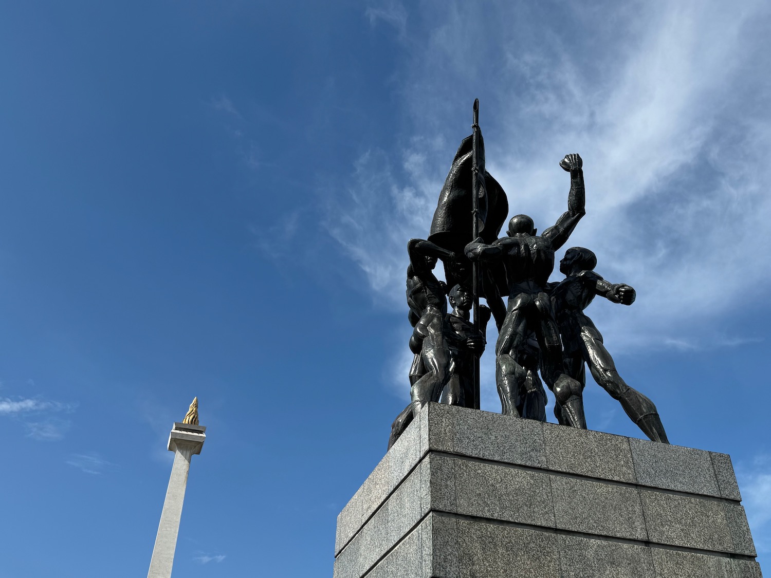 a statue of people on a pedestal