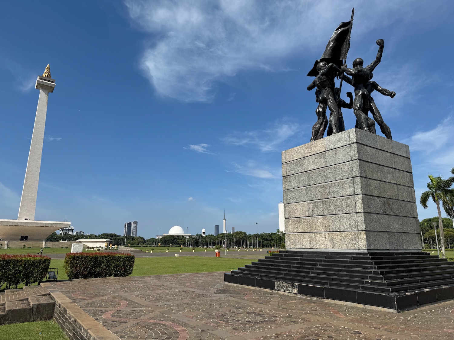 a statue of people on a pedestal