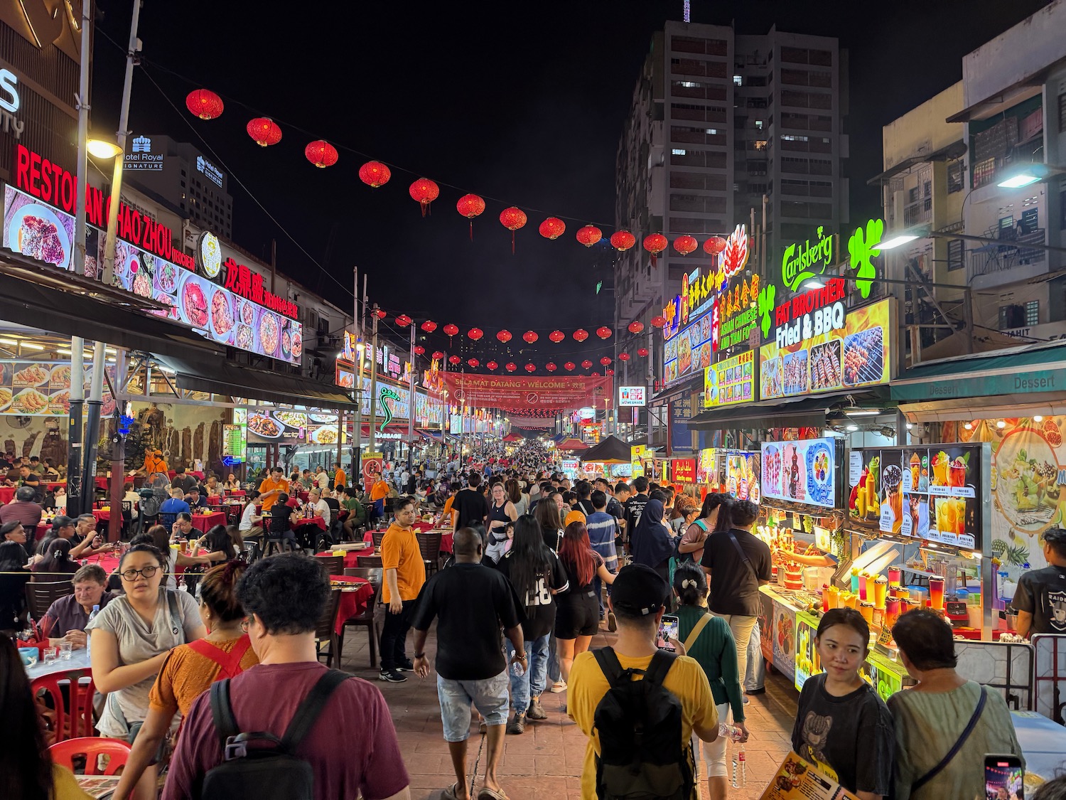a crowd of people walking in a street