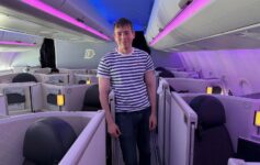 a man standing in a row of seats