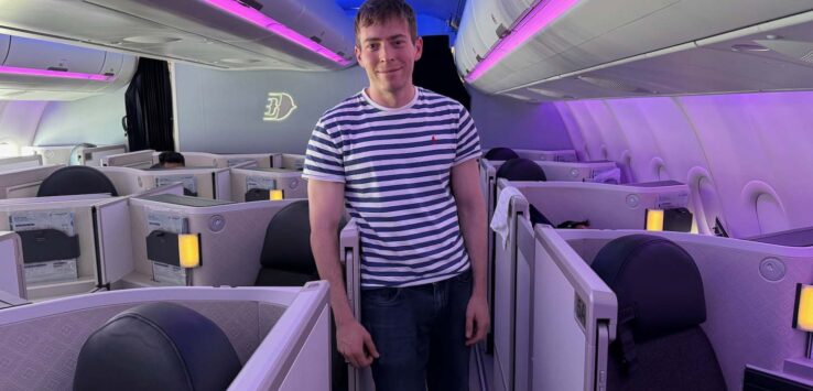 a man standing in a row of seats