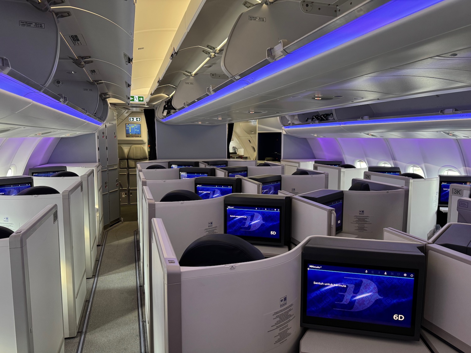 a row of monitors on an airplane