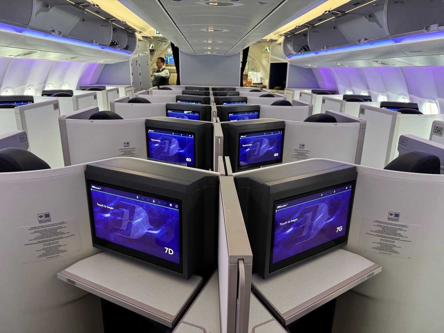 a row of monitors on a plane