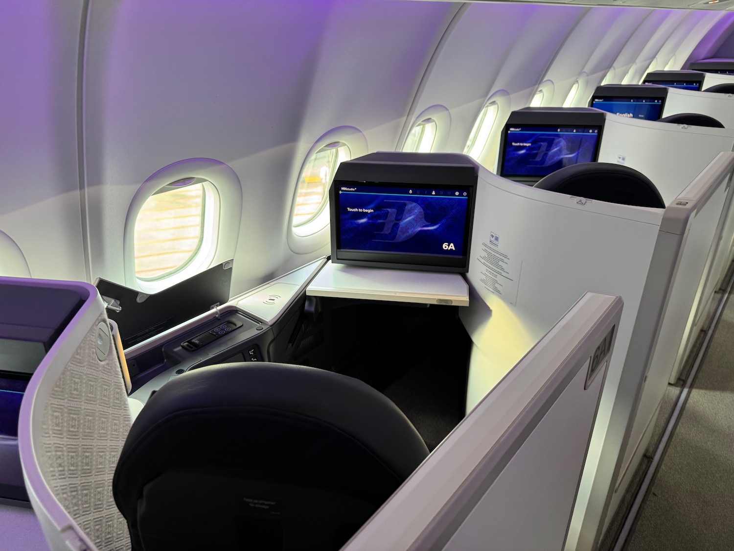 a row of monitors on an airplane