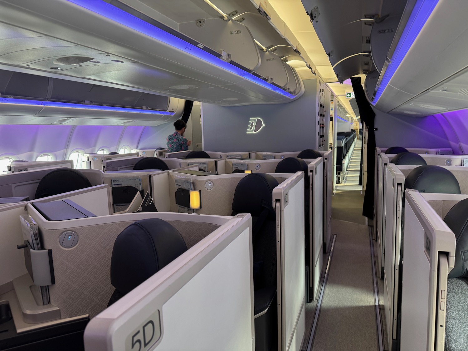 a person standing in a row of seats