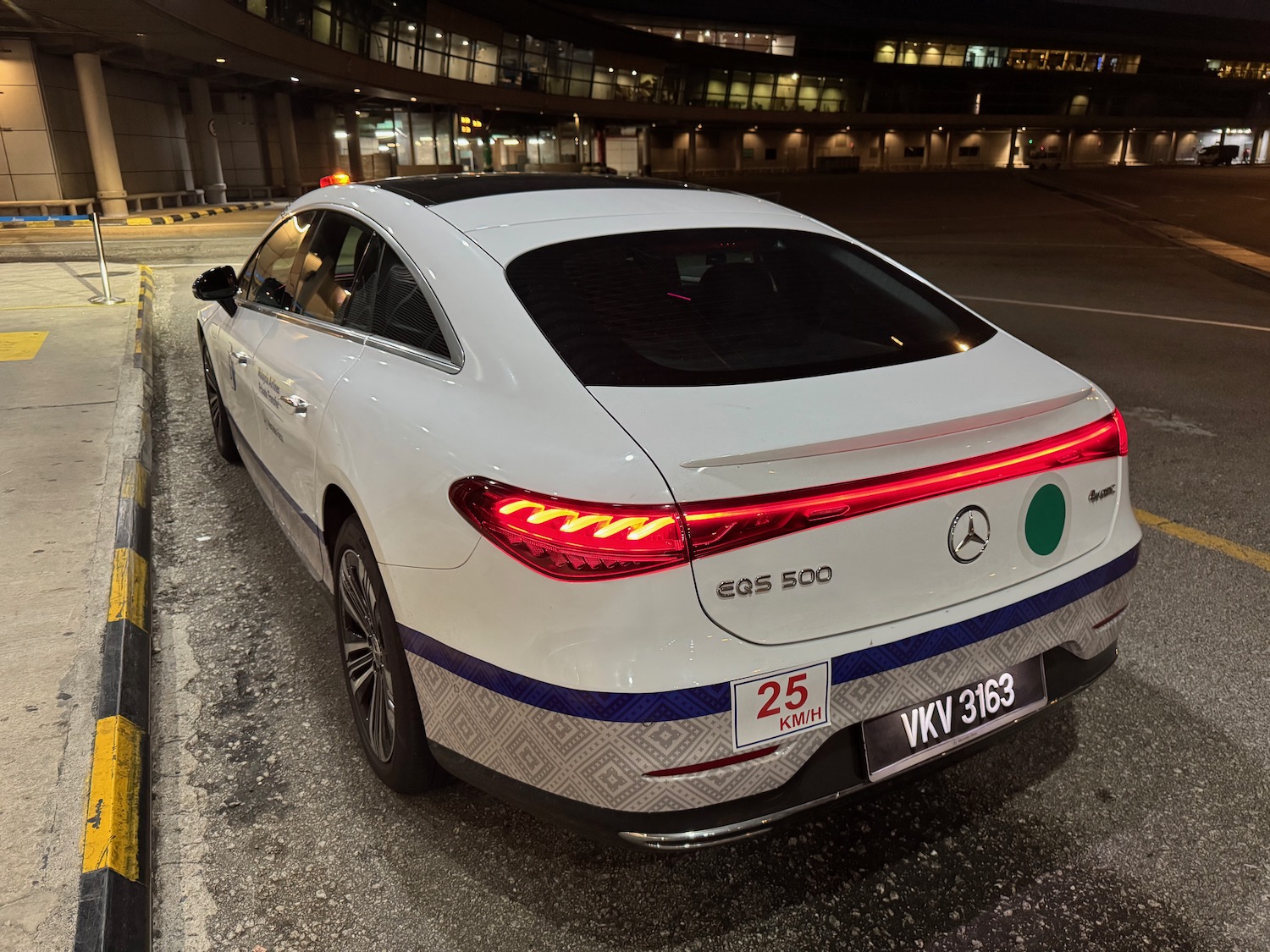 a white car parked in a parking lot
