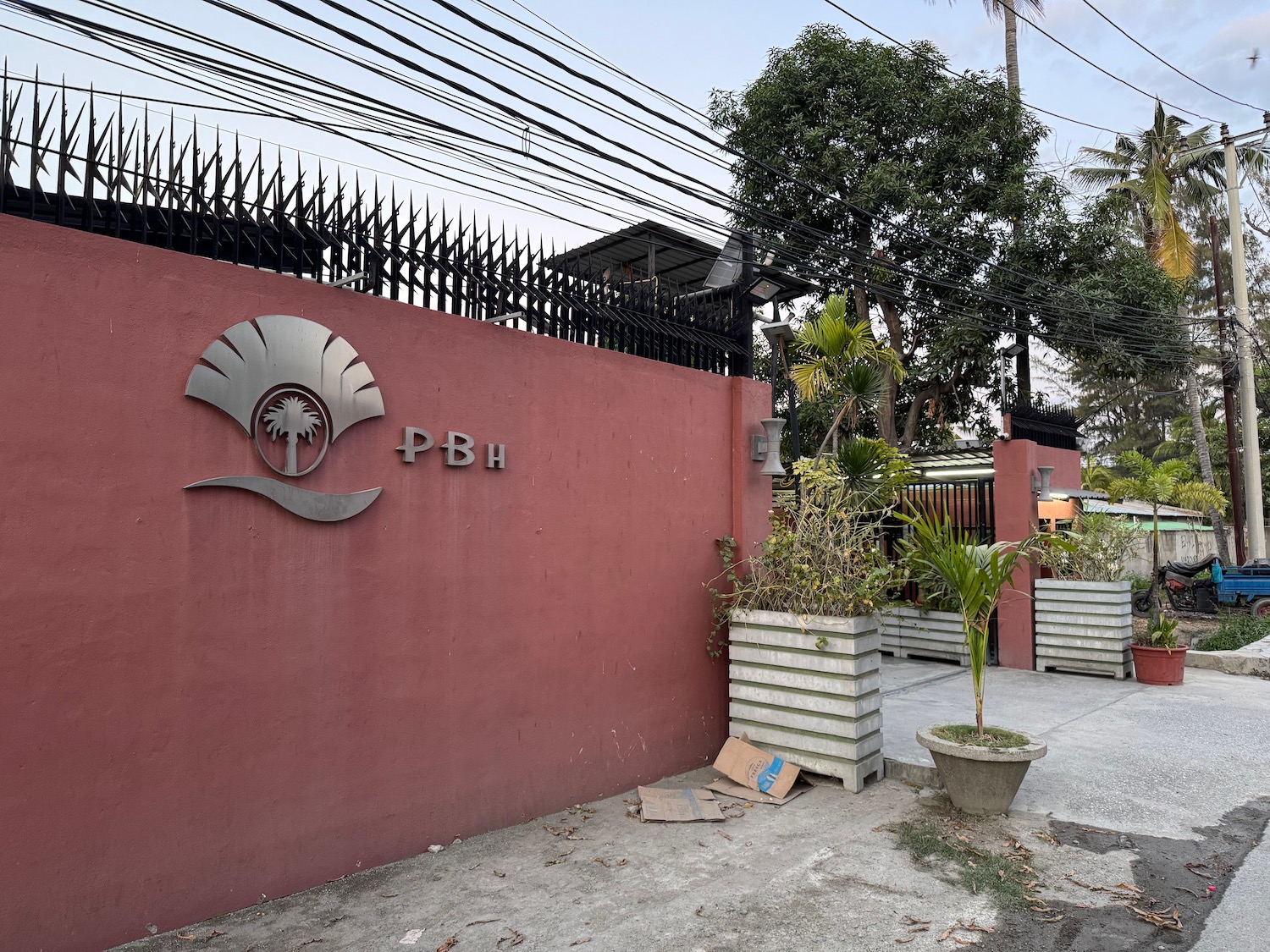 a pink wall with a logo on it